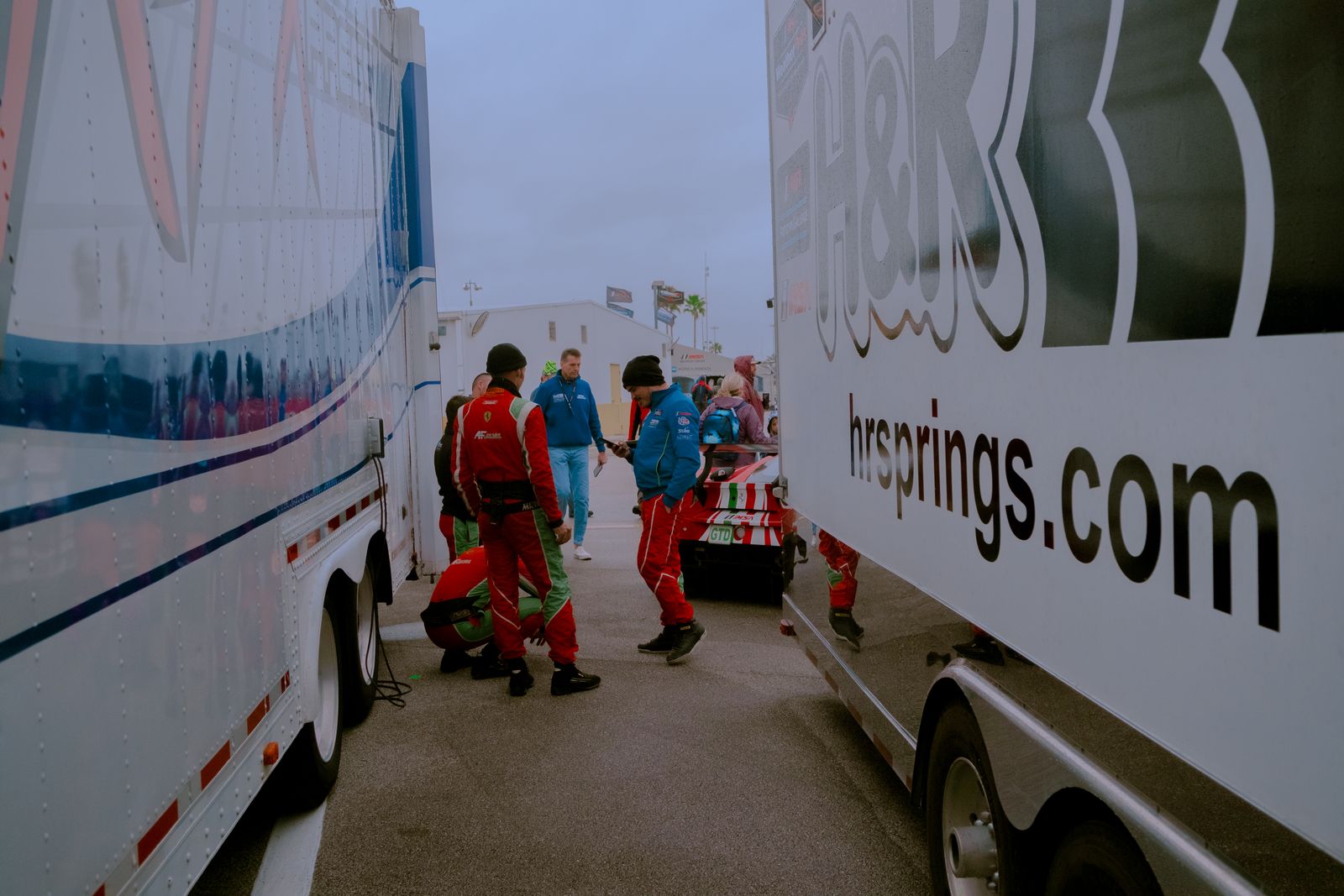 Race team trucks parked in a paddock